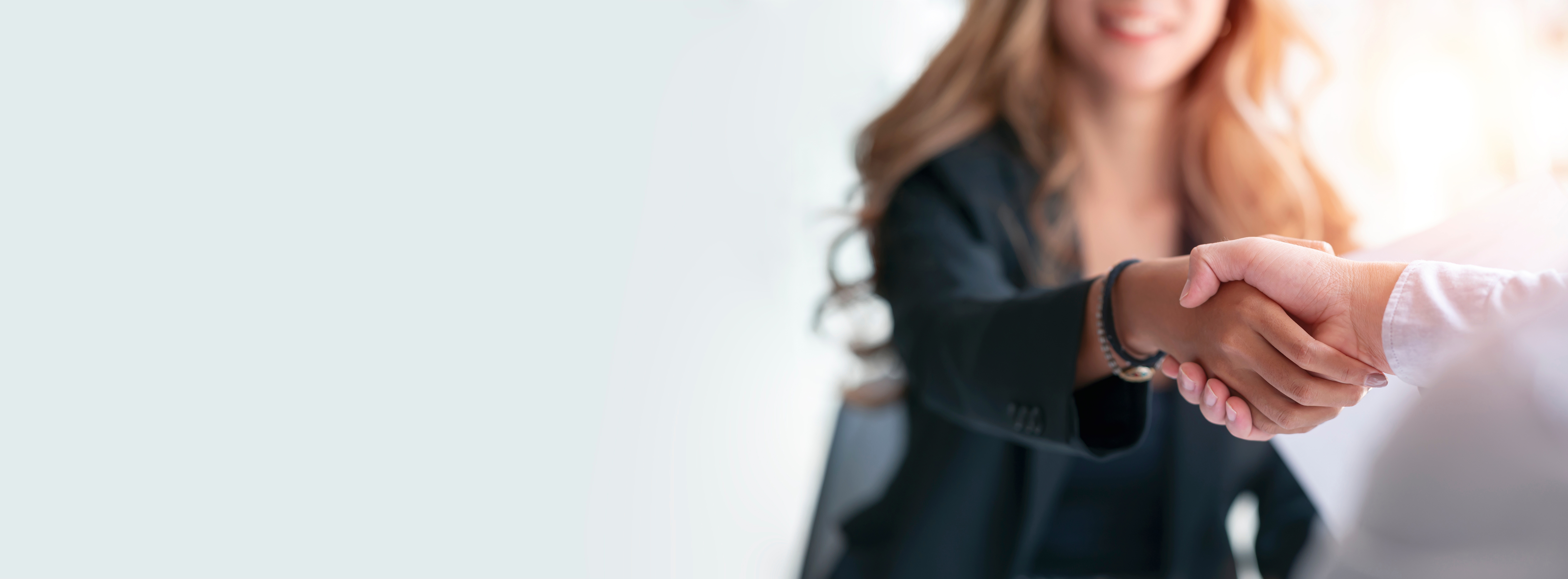 A woman shaking hands with someone